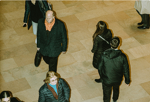 photograph of people walking around